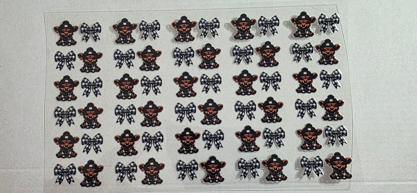 BLACK HIGHLAND COW WITH BOWS